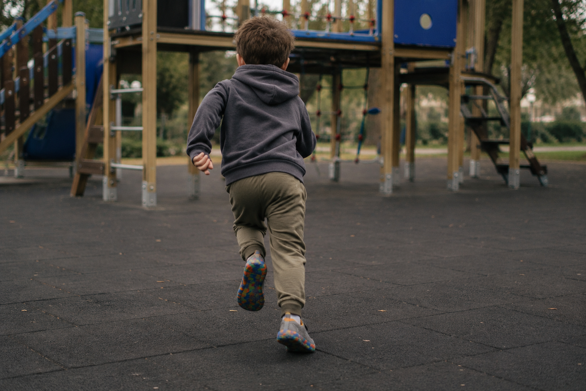A child running across a playground